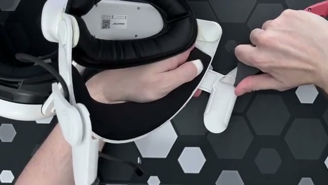 Close-up of the A3 Max side arm while its plastic travel stop is being cut